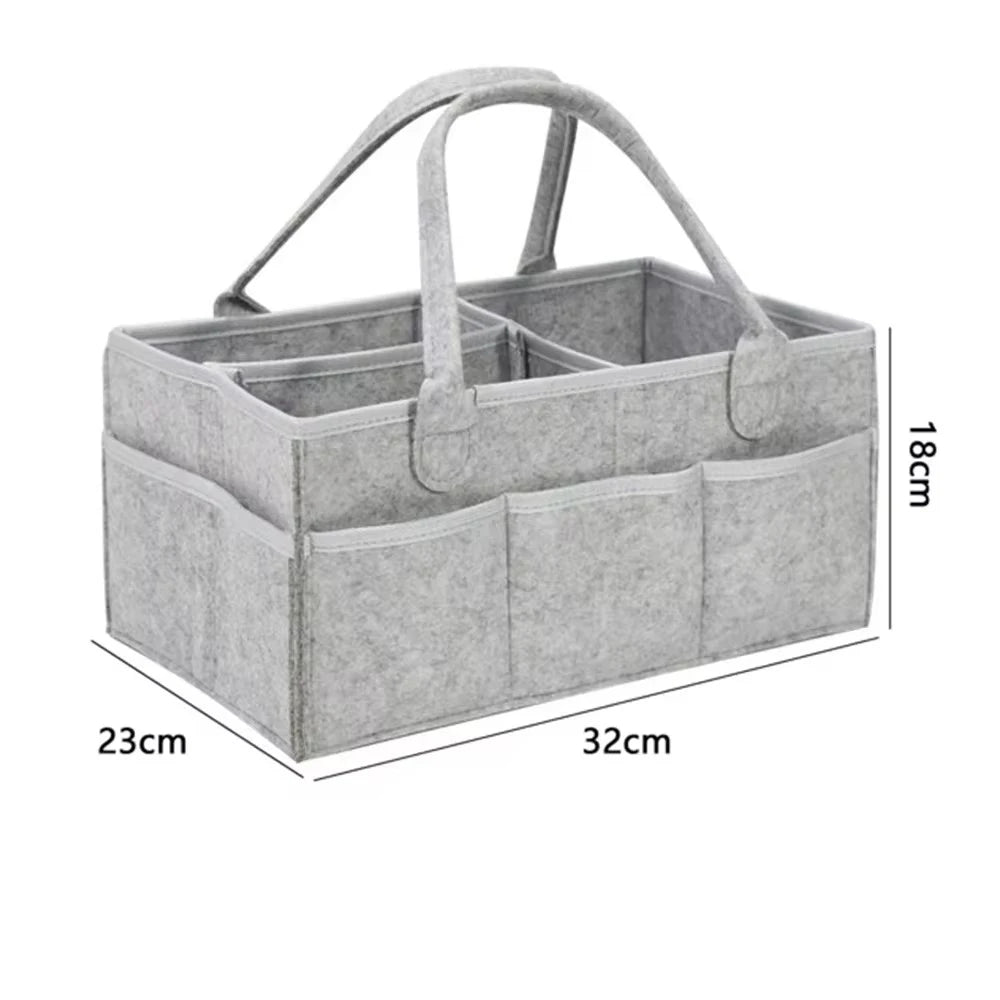 Cesta organizadora gris de artículos para bebé
